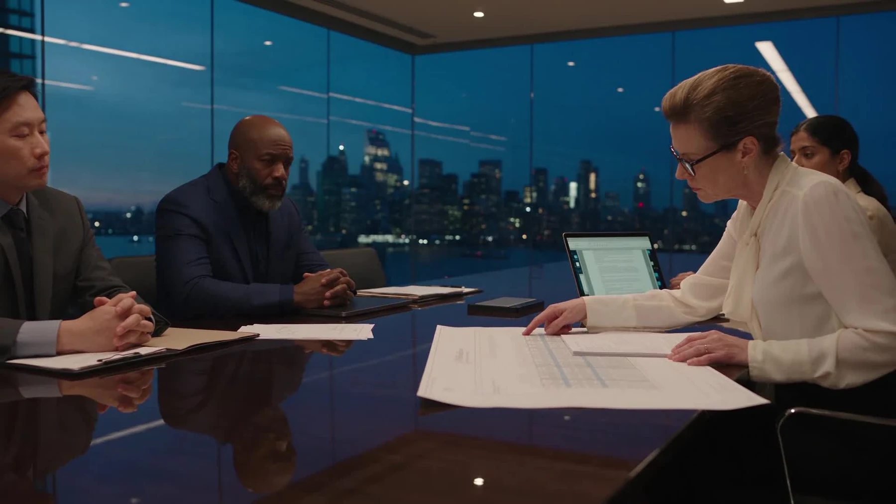 A project team reviewing information together in a boardroom